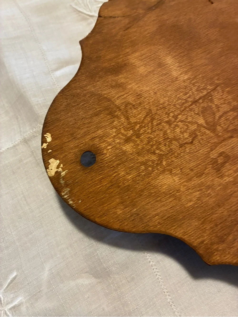 Vintage wood spoon holder with wheat design at the too.